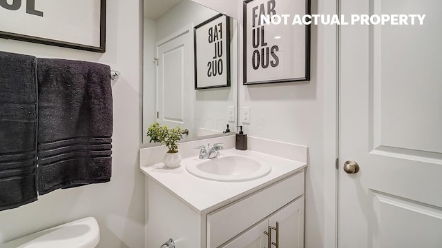 half bathroom featuring vanity