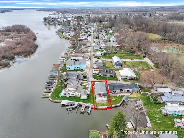 aerial view with a water view and a residential view