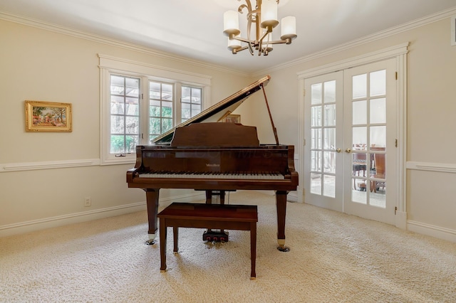 sitting room with carpet, crown molding, french doors, and an inviting chandelier