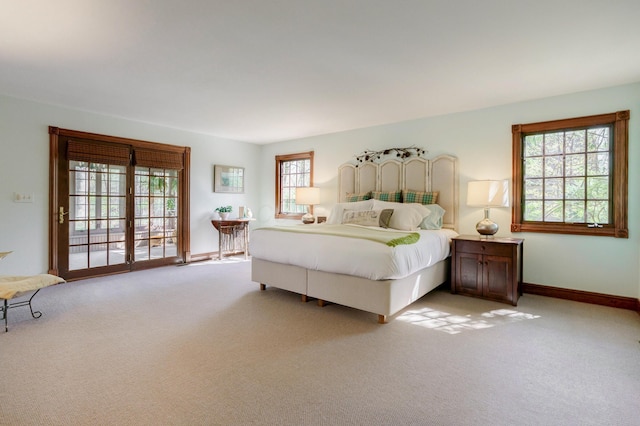bedroom featuring baseboards and carpet floors