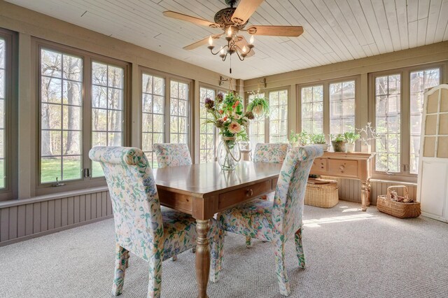 sunroom with carpet flooring, wooden ceiling, and french doors