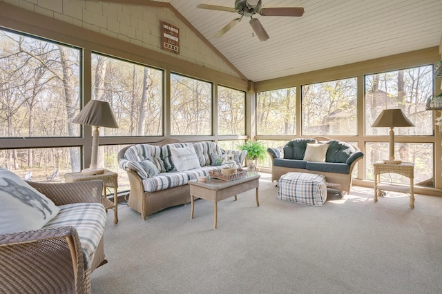 sunroom featuring an outdoor living space, a wealth of natural light, and a ceiling fan