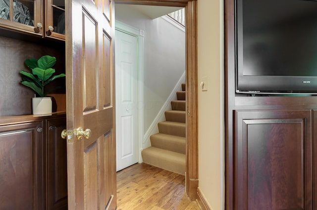 staircase with wood finished floors