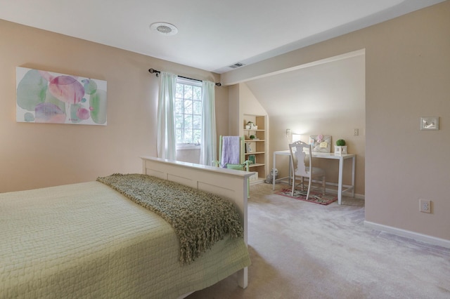 bedroom with carpet floors, visible vents, and baseboards