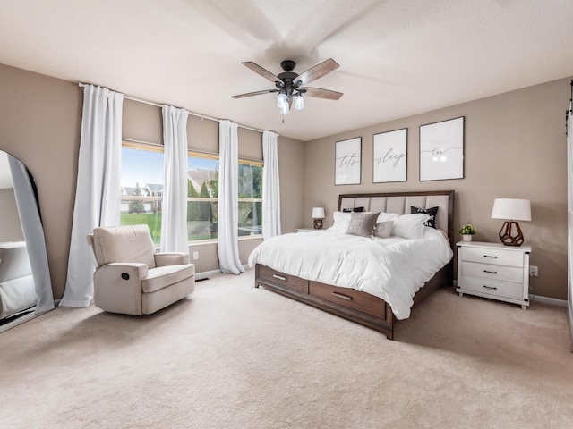 bedroom featuring carpet flooring, baseboards, and a ceiling fan