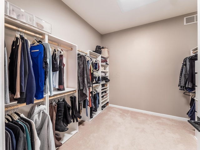 spacious closet with visible vents and carpet