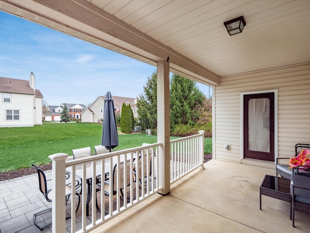 view of patio / terrace featuring a residential view and covered porch