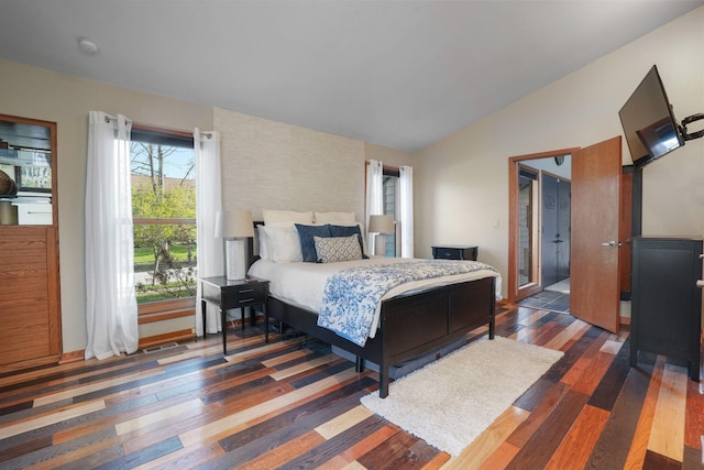 bedroom featuring vaulted ceiling and wood finished floors