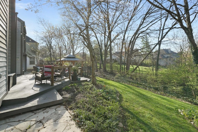 view of yard featuring a gazebo and a deck
