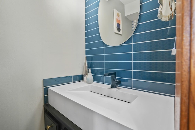 bathroom with vanity and tile walls