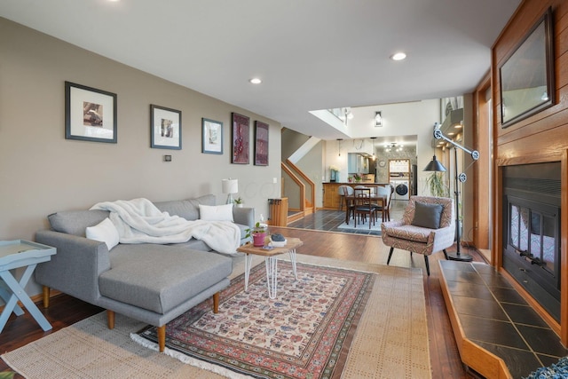 living area with recessed lighting and wood finished floors