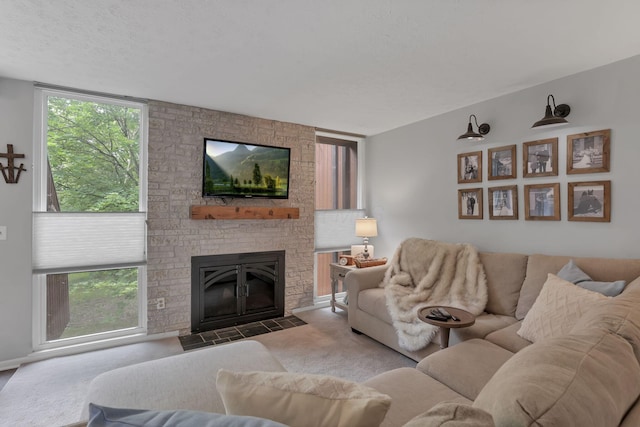 living room with a large fireplace and carpet