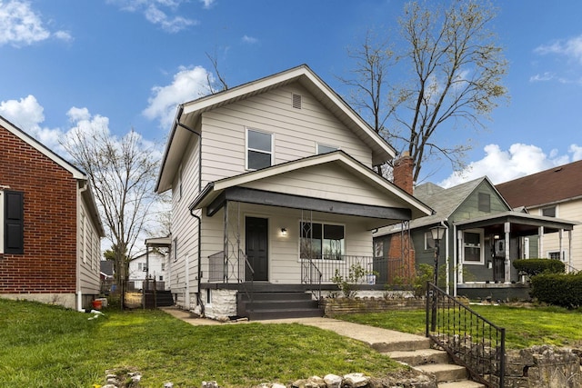 1381 Oakwood Ave, Columbus, OH 43206 - view of front of home featuring covered porch and a front yard