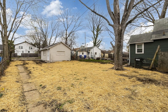 1381 Oakwood Ave, Columbus, OH 43206 - view of yard with an outbuilding, a storage unit, a fenced backyard, and a residential view