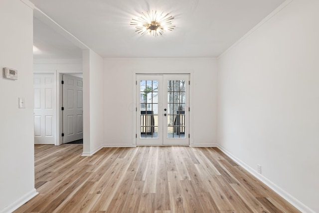 1381 Oakwood Ave, Columbus, OH 43206 - empty room featuring french doors, baseboards, and light wood finished floors