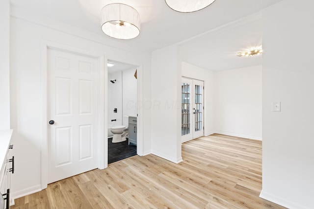 1381 Oakwood Ave, Columbus, OH 43206 - unfurnished room featuring baseboards, light wood-style flooring, and french doors