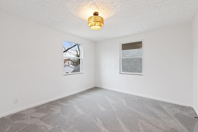 1381 Oakwood Ave, Columbus, OH 43206 - carpeted spare room featuring baseboards and a textured ceiling