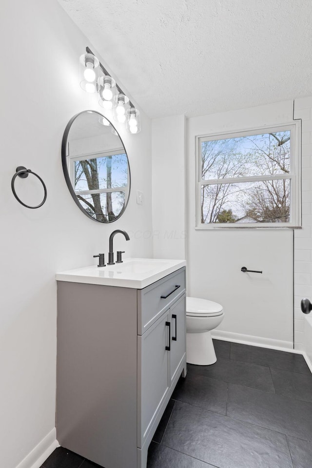 1381 Oakwood Ave, Columbus, OH 43206 - bathroom with a textured ceiling, toilet, and vanity