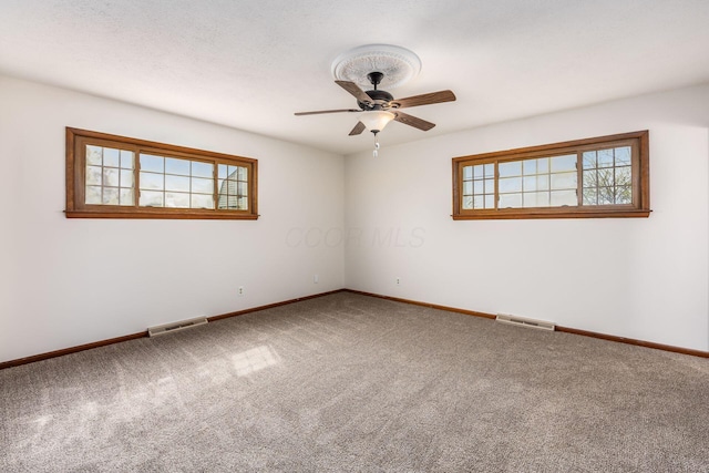 306 Northview Dr, London, OH 43140 - carpeted spare room with baseboards, ceiling fan, and visible vents