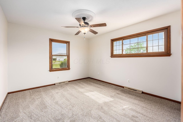 306 Northview Dr, London, OH 43140 - unfurnished room with visible vents, carpet flooring, baseboards, and ceiling fan