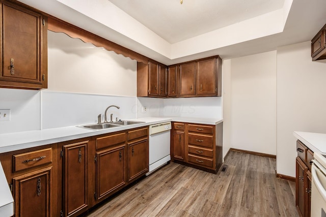 306 Northview Dr, London, OH 43140 - kitchen with visible vents, wood finished floors, dishwasher, a sink, and light countertops
