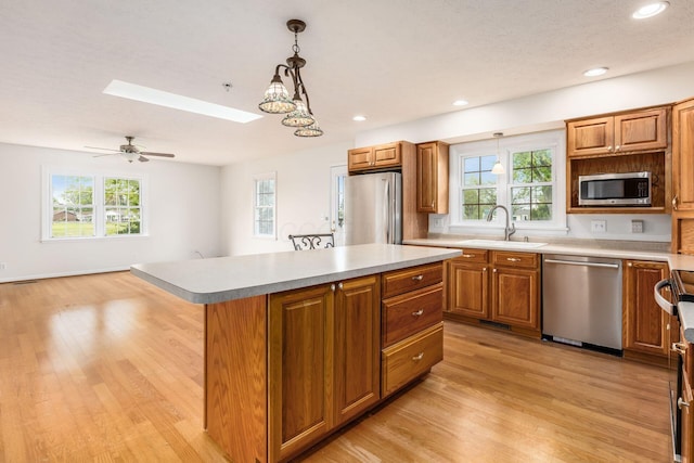306 Northview Dr, London, OH 43140 - kitchen featuring a sink, light wood finished floors, a healthy amount of sunlight, and stainless steel appliances