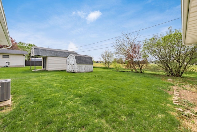 306 Northview Dr, London, OH 43140 - view of yard featuring a storage shed, an outdoor structure, and cooling unit