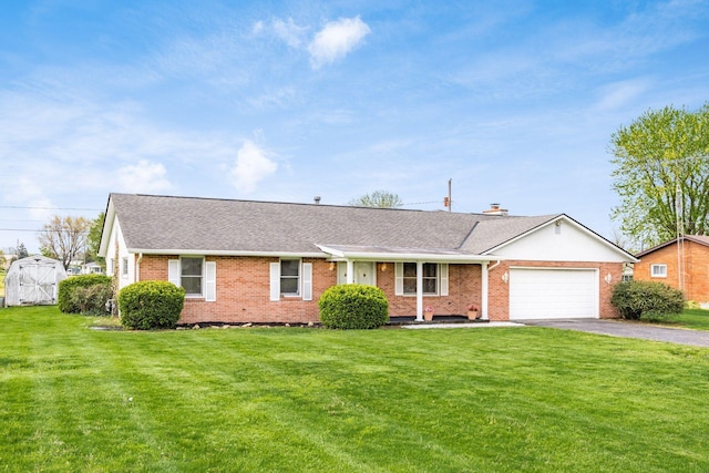 306 Northview Dr, London, OH 43140 - ranch-style house with an attached garage, aphalt driveway, a shingled roof, a front yard, and brick siding