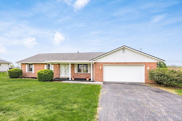306 Northview Dr, London, OH 43140 - single story home with driveway, brick siding, a front lawn, an attached garage, and a shingled roof