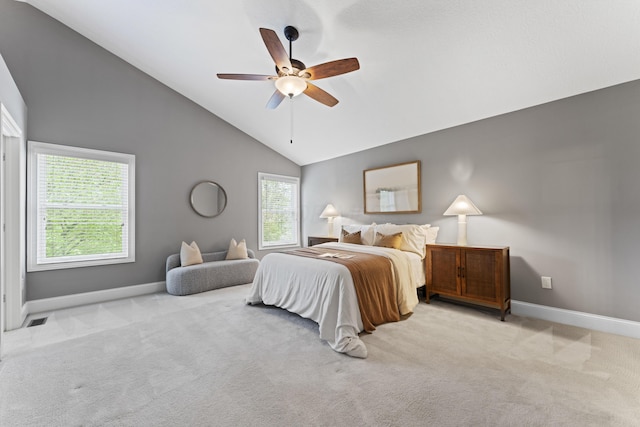 bedroom with carpet flooring, vaulted ceiling, baseboards, and visible vents