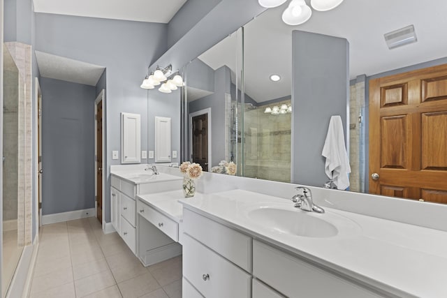 full bathroom featuring a stall shower, baseboards, visible vents, tile patterned flooring, and vanity