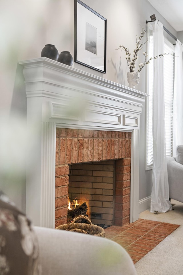 room details with carpet flooring and a warm lit fireplace