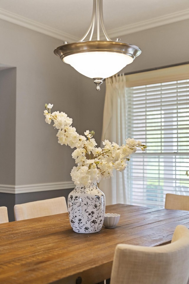 dining area featuring ornamental molding