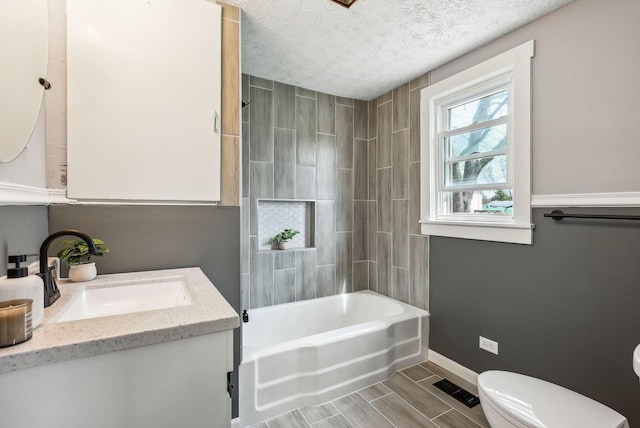 full bath with a textured ceiling, visible vents, baseboards, toilet, and vanity
