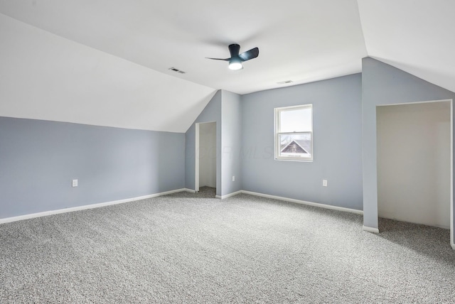 bonus room with visible vents, lofted ceiling, carpet flooring, and a ceiling fan