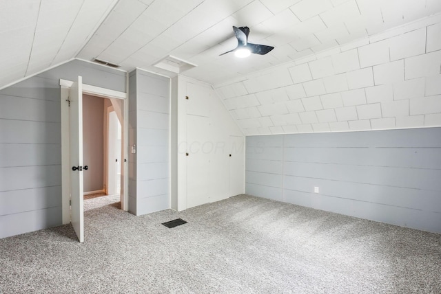 bonus room featuring carpet floors, visible vents, vaulted ceiling, and ceiling fan