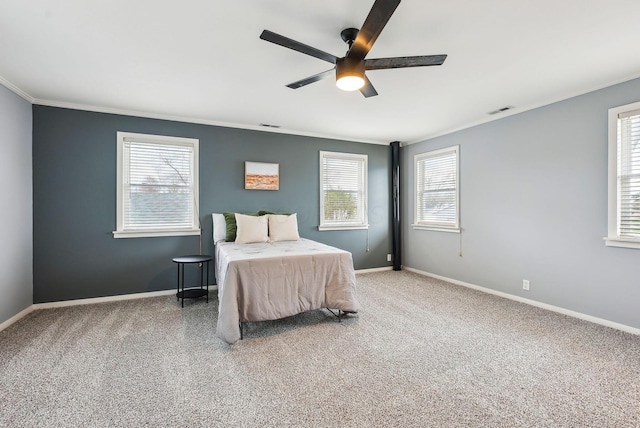 carpeted bedroom with multiple windows, visible vents, and baseboards
