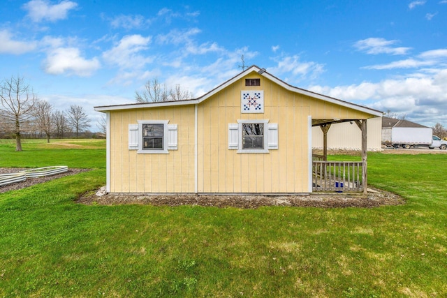 view of side of property with a yard
