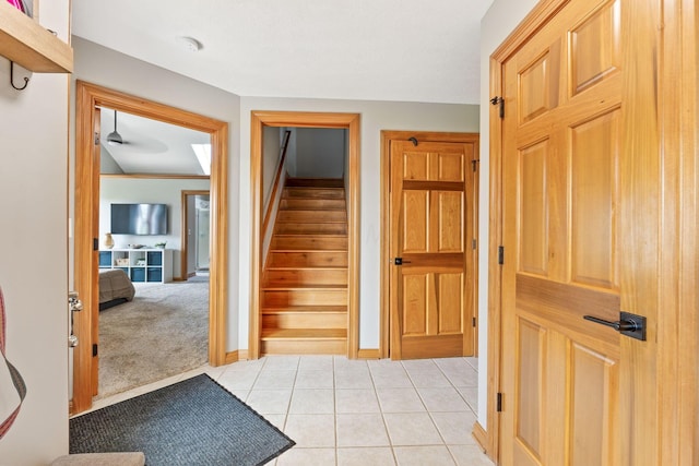 interior space featuring baseboards and tile patterned flooring