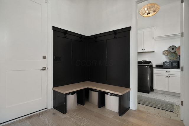 mudroom featuring washer / dryer and light wood-style floors