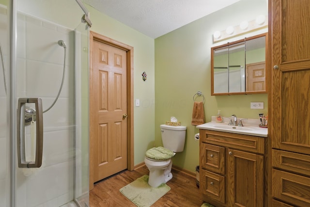 1397 Underwood Farms Blvd, Columbus, OH 43230 - full bathroom featuring a shower stall, toilet, vanity, and wood finished floors