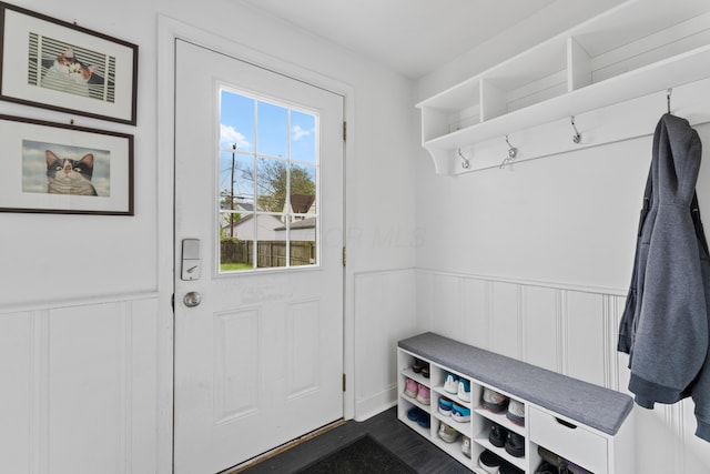 mudroom featuring a wainscoted wall and a decorative wall