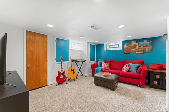 carpeted living area featuring recessed lighting