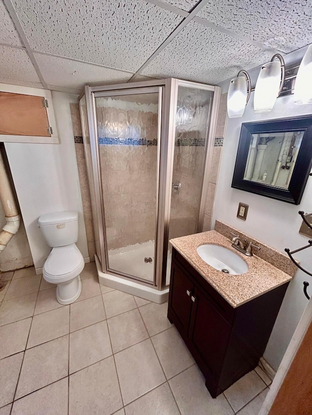 742 S Cassingham Rd, Bexley, OH 43209 - full bathroom featuring vanity, a shower stall, a drop ceiling, and tile patterned floors