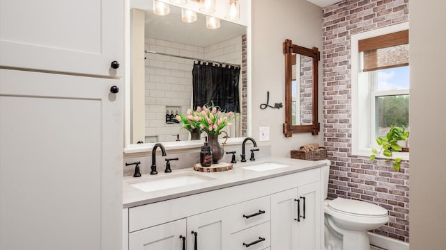 5456 Skyline Dr, Cambridge, OH 43725 - full bathroom with double vanity, a sink, toilet, and brick wall