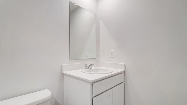 half bath with toilet and vanity
