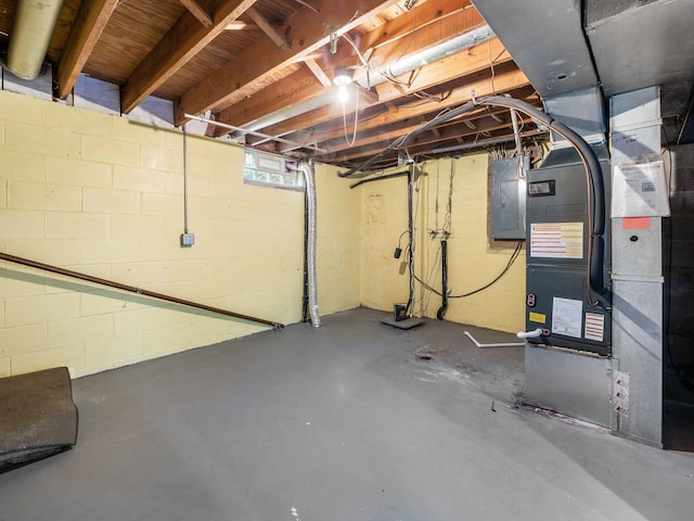 basement with electric panel and heating unit