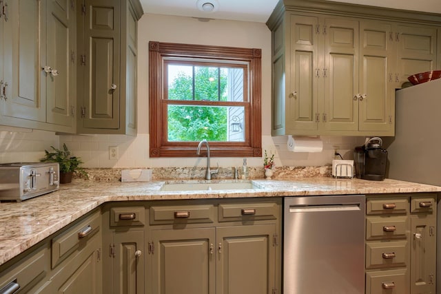 kitchen with backsplash, a sink, stainless steel dishwasher, and a toaster