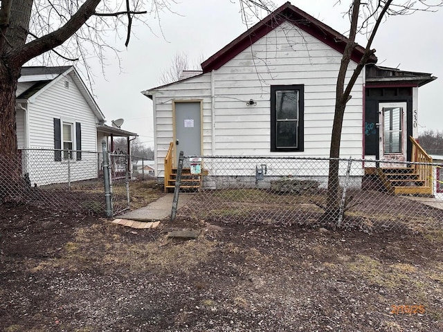 530 Harrison St, New Lexington, OH 43764 - back of property featuring a fenced front yard and entry steps