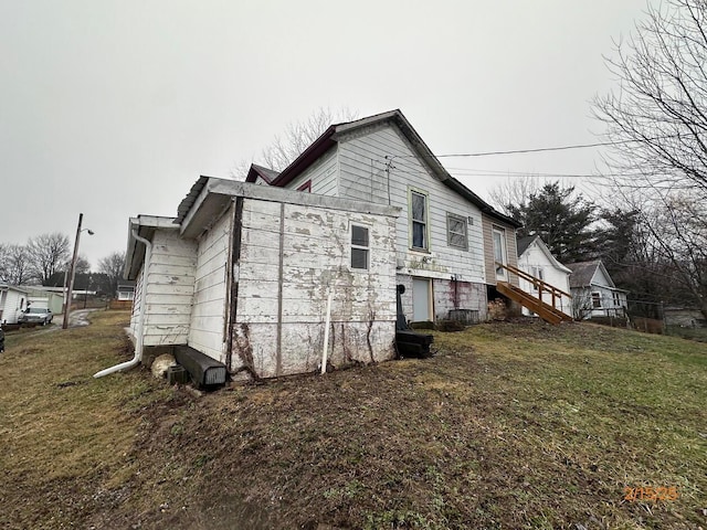 530 Harrison St, New Lexington, OH 43764 - view of property exterior with a lawn